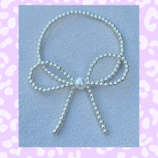 Classic Sterling Silver and Pearl Accent Bow Bracelet